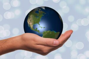 hand holding small globe