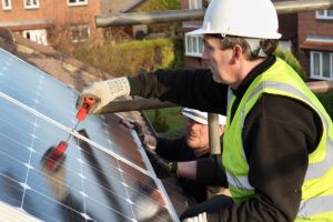 solar panels being fitted on roof