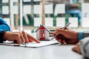 Customers interested in buying a home sign a signature 